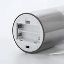 Three-piece flameless LED pillar candle set made of glass, with a remote control, displayed without packaging.