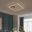 Modern artistic design geometric aluminum pendant light with LED technology, featuring a brown shade, highlighted in an interior setting with wooden furniture, a chair, and a plant near a window.