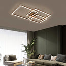 Modern artistic design geometric aluminum pendant light with LED technology, displayed in a stylish living room setting with a couch, plant, and wooden elements.