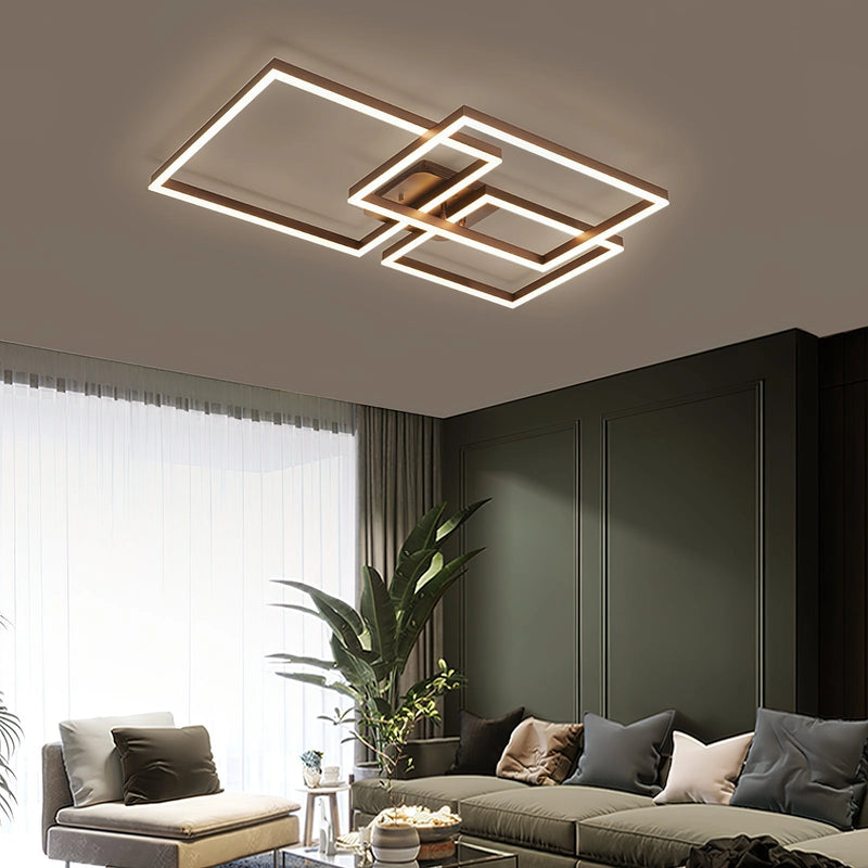 Modern artistic design geometric aluminum pendant light with LED technology, displayed in a stylish living room setting with a couch, plant, and wooden elements.