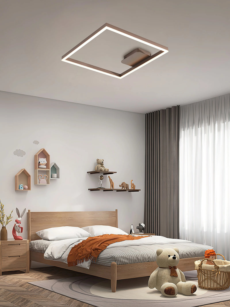 Artistic geometric aluminum pendant light featuring LED technology, displayed in a modern interior with grey and beige walls and wooden flooring.