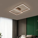 Modern artistic geometric aluminum pendant light featuring LED technology, displayed in a stylish interior setting with a couch, wood accents, and plants, enhancing the comfort and design of the space.