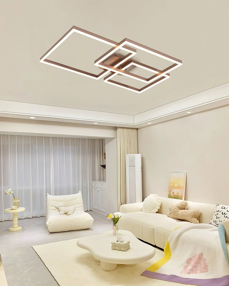 Modern artistic design geometric aluminum pendant light with LED technology, displayed over a wooden table in a stylishly decorated interior with architectural elements.