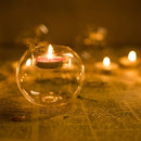 Amber glass candle holder designed for votive and tealight candles, featuring a fluid-like design suitable for bar and home decor.