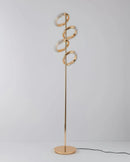 Gold diamond-patterned adjustable angles floor lamp with a metallic finish, featuring intricate twig-like details and a balance of art and fashion elements.