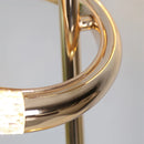 Gold diamond-patterned floor lamp featuring adjustable angles, made from metal with intricate details reminiscent of musical instruments and jewelry elements.