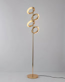 Gold floor lamp with a diamond-patterned design, adjustable angles, featuring metal and wood elements, and decorated with jewelry-like embellishments.