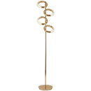 Gold diamond-patterned adjustable angles floor lamp with a metallic finish and artistic design elements, set against a plant backdrop.