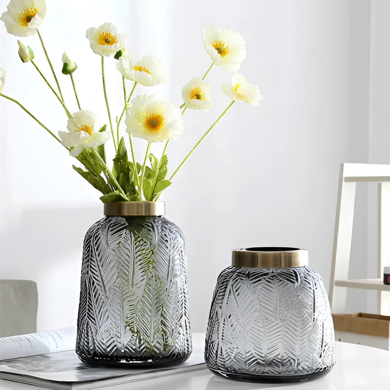 Green glass vase designed in Nordic style, filled with hydroponic plants, featuring a rectangular shape ideal for flower arranging.