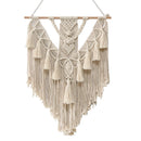 Handwoven macrame Boho wall hanging tapestry featuring geometric patterns and symmetry, displayed on a wooden clothes hanger.