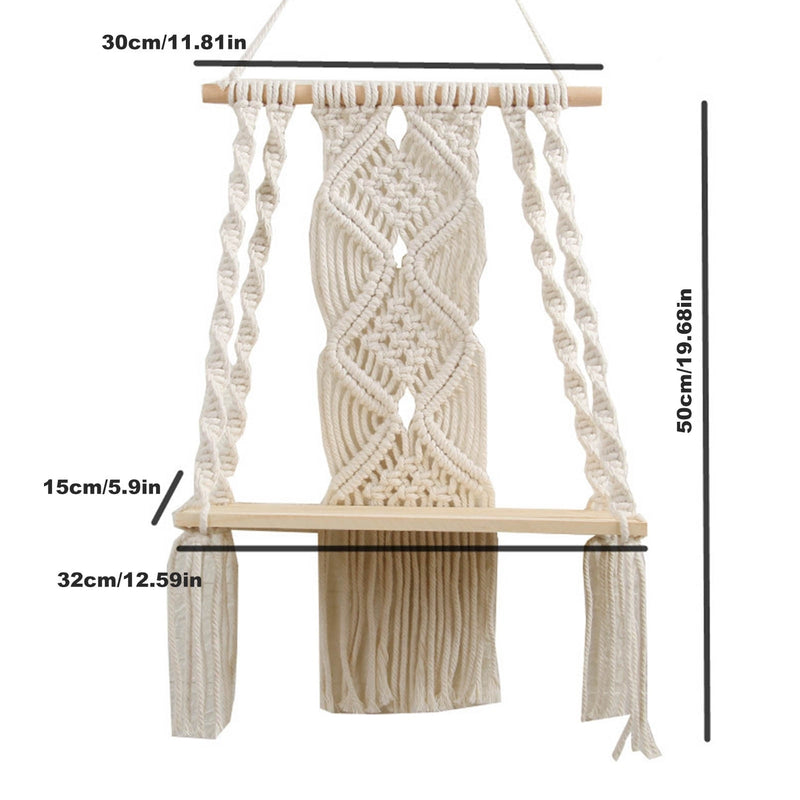 Handwoven macrame boho wall hanging tapestry with geometric patterns displayed outdoors, complemented by wooden and metal furniture.