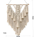 Handwoven macrame boho wall hanging tapestry featuring geometric art decor in beige, displayed on a wooden clothes hanger, showcasing symmetry and intricate patterns.