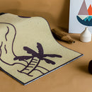 Black and white tropical-themed PVC rug mat with 'Aloha' text, designed for both indoor and outdoor use, displayed on a wooden surface.