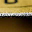 Rectangular beige and grey tropical aloha PVC rug mat with a wood-effect design, displayed on a hardwood surface, enhancing an indoor or outdoor setting.