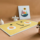 Rectangular PVC rug mat featuring a tropical Aloha design with artistic elements on a wooden floor background.