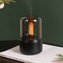 LED aromatherapy diffuser designed to mimic candle light effect, featuring a cylindrical shape and made from composite materials.