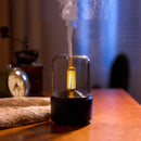 LED aromatherapy diffuser on a wooden table, featuring a candle light effect and a serene, modern interior design.