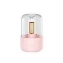 LED aromatherapy diffuser in Rosa with a candle light effect, featuring a cylindrical shape with metallic elements and a USB connector.