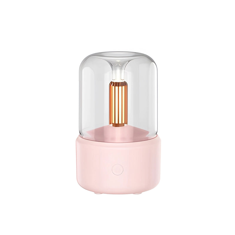 LED aromatherapy diffuser in Rosa with a candle light effect, featuring a cylindrical shape with metallic elements and a USB connector.