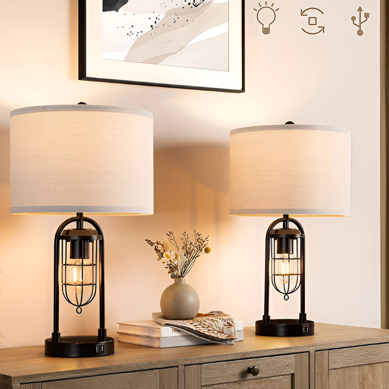 LED desk lamp with dual bulb design, featuring USB ports, displayed on a wooden countertop with a plant in the background, emphasizing modern interior design and lighting.