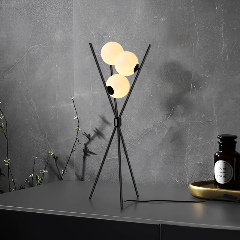 Modern LED Moonlamp designed for living rooms, featuring a sleek street light-inspired design with artistic elements, surrounded by plants and subtle wall shadows.