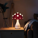 LED mushroom table lamp with warm white light displayed on a wooden table, complemented by interior design elements including a vase and a drawer.