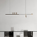 Sleek Nordic-inspired LED pendant light hanging over a modern desk with chairs, featuring a minimalist rectangle design and shelving in the background.