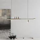 Sleek Nordic-inspired LED pendant light featuring a metal design with wood accents, elegantly hanging in a room with a wooden door and walls.