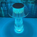 LED table lamp featuring steepless dimming, displayed on a blue-themed table setting with artistic elements and a background of trees and water.