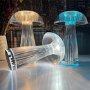 LED table lamp featuring steepless dimming and a large battery, designed with a sculptural art style, glass material, and resembling a street light.