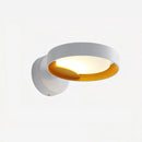 A set of two contemporary LED wall lights featuring a white and orange artistic design, crafted from iron and acrylic, emitting a cool light.