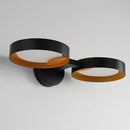 Contemporary iron and acrylic LED wall light featuring an artistic sconce design.