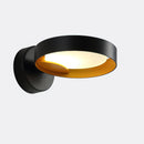 Contemporary iron and acrylic LED wall sconce featuring an artistic circular design.