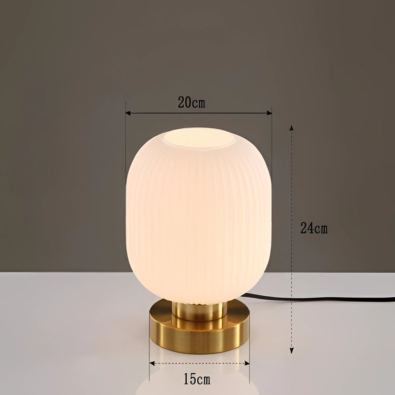 White luminescent crystal table lamp featuring a circular design and subtle shades, ideal for enhancing room ambiance.