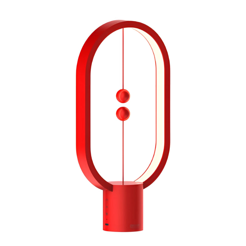 Red Magnetic Balance Table Lamp with LED Lighting featuring a circular magenta design and geometric shapes.