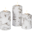 Set of three marble-patterned LED flameless candles in cylindrical shapes, displayed in a rectangular glass candle holder, ideal for home decor or events.