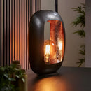Vintage style large table lamp crafted from metal with a design resembling automotive headlamps, featuring amber-colored glass and wooden base elements.