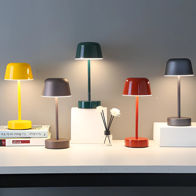 Metal Table Lamp from the Pulse Flare collection featuring adjustable brightness, showcased in an interior design setting with grey and wood elements, complemented by art and shelving.