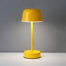 Yellow Metal Table Lamp with Adjustable Brightness - Pulse Flare, featuring a lampshade with tints and shades, set on a wooden base with rectangular and circular elements, highlighted in electric blue.