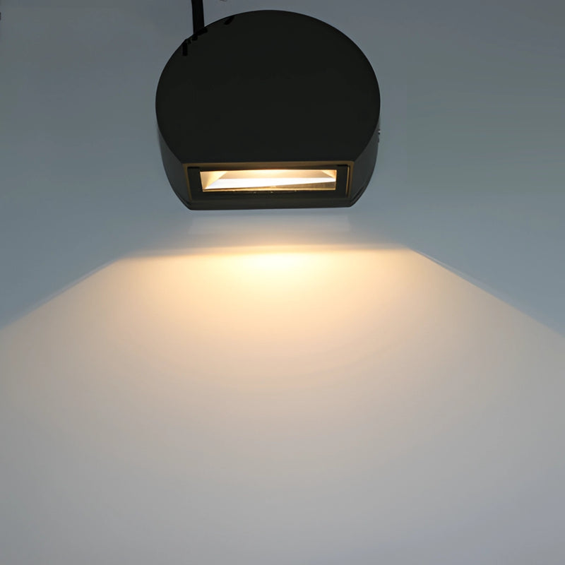 LED wall lamp sconce in sand black and grey, featuring a rectangular aluminum and borosilicate glass design with a circular light fixture.