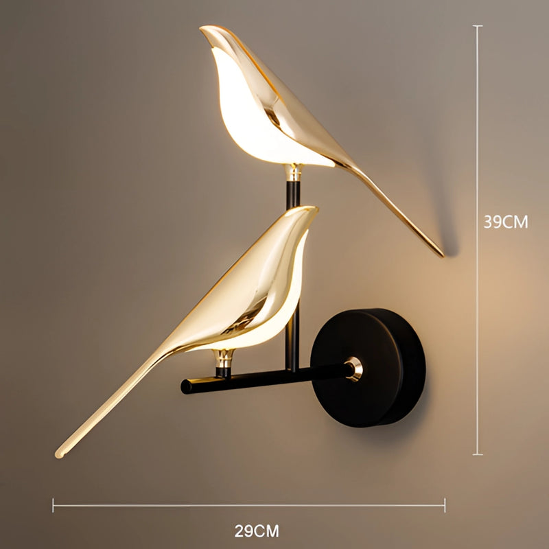 Modern Rotatable Wall Sconce with a 360-degree lampshade in gold, featuring a two-head design emitting warm light, mounted on a wood surface with artistic and metallic elements.