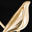 Gold modern rotatable wall sconce with a 360-degree adjustable lampshade.