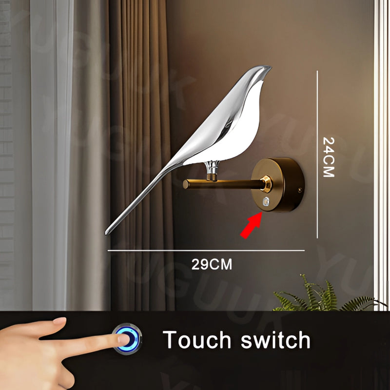 Modern rotatable wall sconce with a 360-degree lampshade in silver, featuring a warm light setting, mounted on a wooden door with visible handles and plant accents.