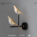 Gold modern rotatable wall sconce with a 360-degree lampshade, featuring a circular, metallic design.