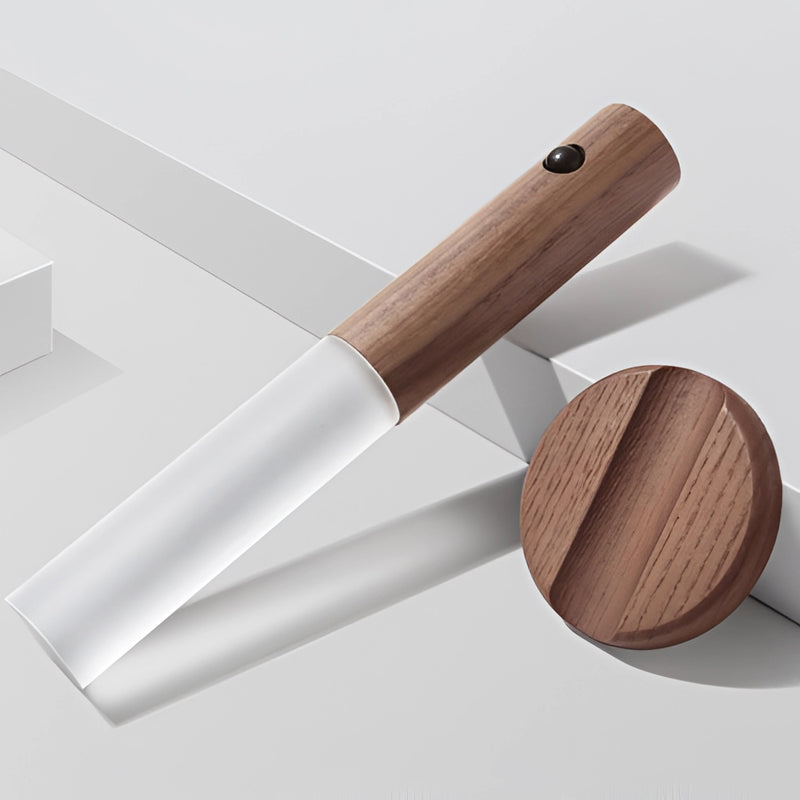Motion Sensor LED Rechargeable Night Light designed with a wooden appearance, featuring elements of metal and composite materials, placed in an indoor setting.