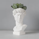 Neoclassical Greek head resin vase designed as a sculpture with detailed carving, resembling a jaw and other facial features, perfect for artistic home decor.