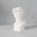 Small David variant of Neoclassical Greek head resin vase, resembling a classical sculpture with detailed carving of the jaw, chin, and facial features.