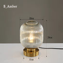 Nordic Amber Table Lamp featuring a stained glass shade with intricate metalwork and artistic design elements, in variant B Amber.