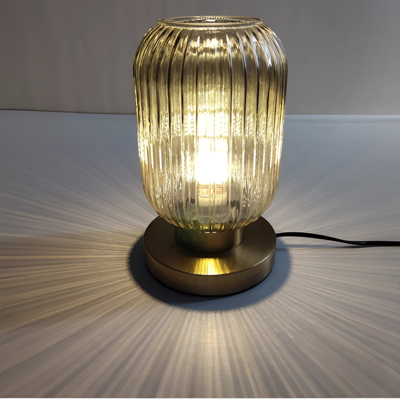 Nordic Amber Table Lamp featuring a stained glass shade on a wooden table, highlighted by its artistic and intricate design.