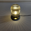 Nordic Amber Table Lamp featuring a stained glass shade, illuminated light bulb visible under the chandelier-style fixture.